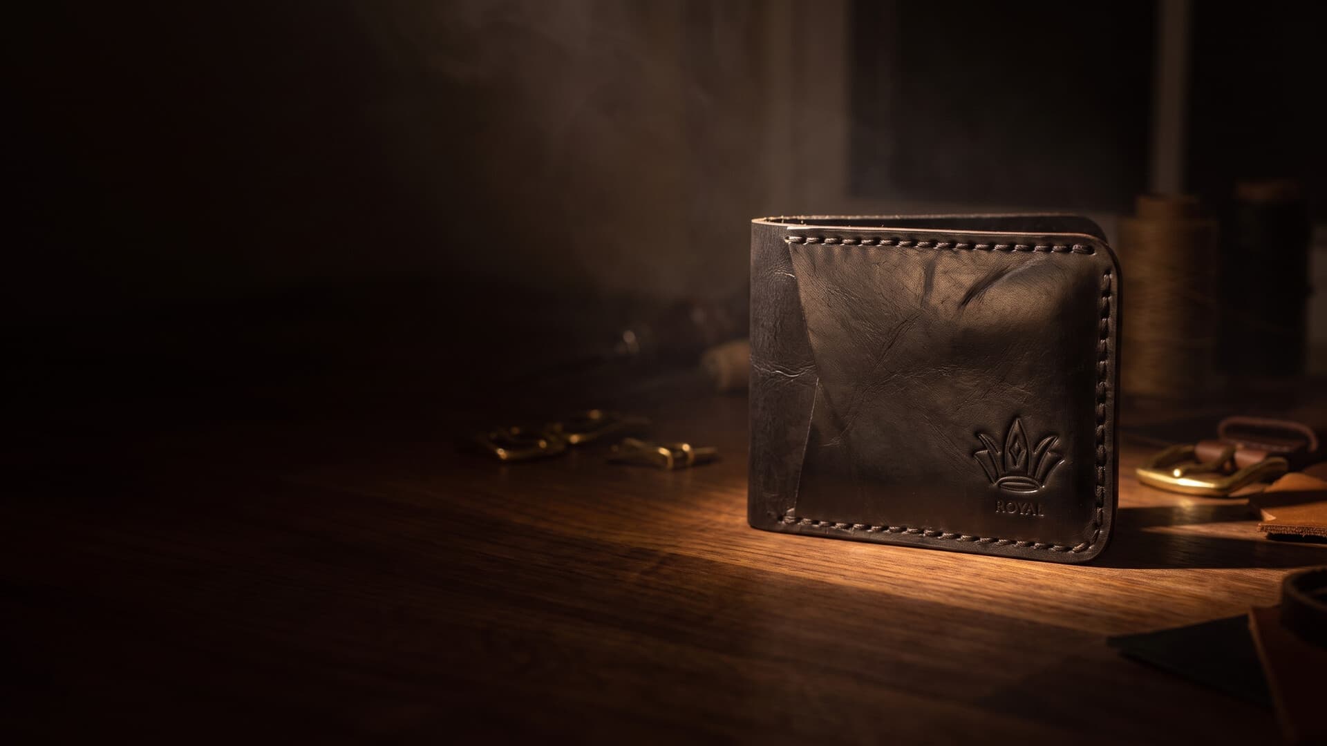 Handcrafted black full-grain leather bifold wallet with embossed ROYAL crown, made in Alexandria, Virginia